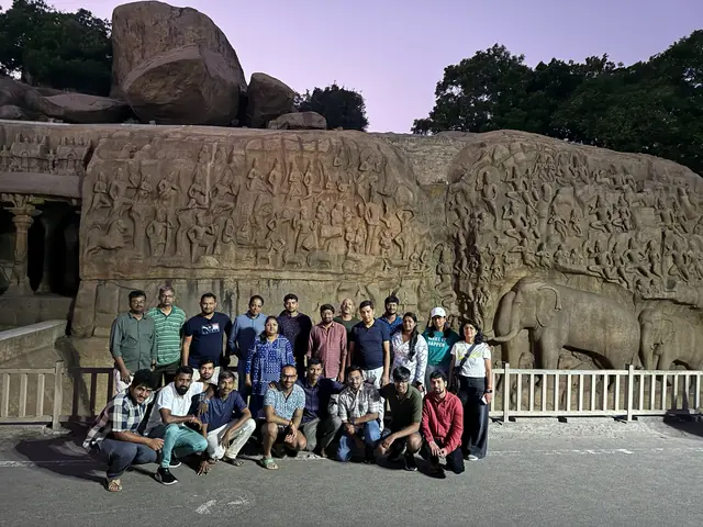 The team in front of Arjuna's Penance, the carved rock relief at Mahabalipuram, at dusk